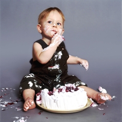 picture of baby with white, flowered icing, half-eaten birthday cake in front of him! This helps him tie in sign language concepts for birthday, cake, and party